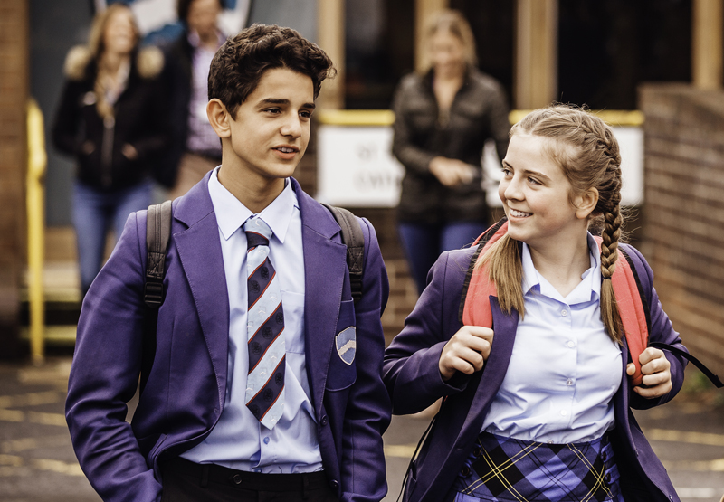 Two pupils leave school for the day