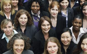 Businesswomen look to the camera