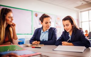 Teacher helps her students