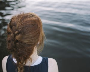 Young woman by a lake
