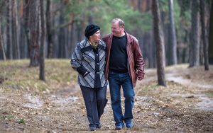 Middle age couple walking in the woods