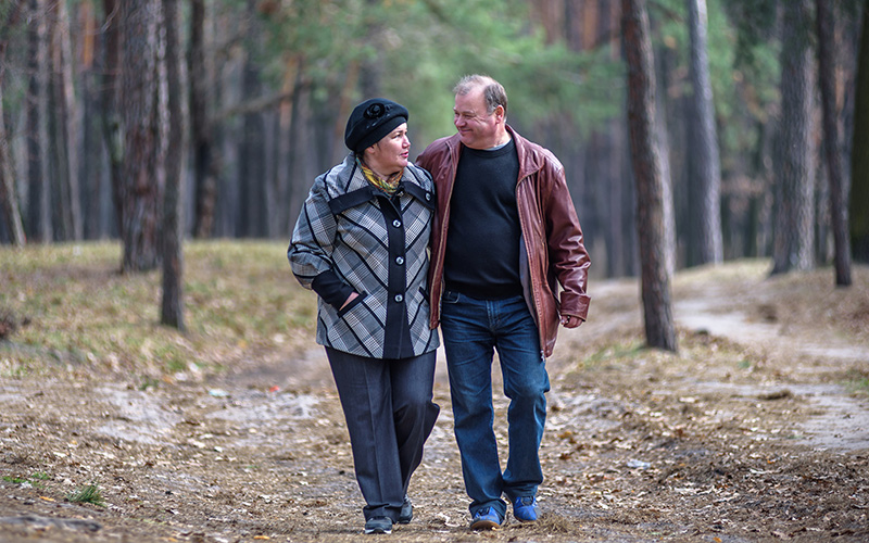Middle age couple walking in the woods