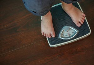 Child stands on scales