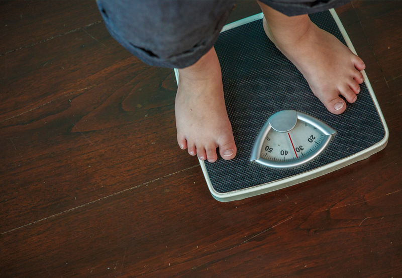 Child stands on scales