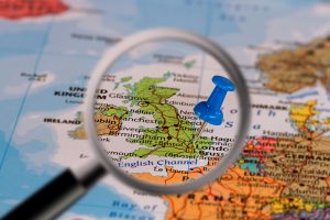 Magnifying glass over a map of the UK