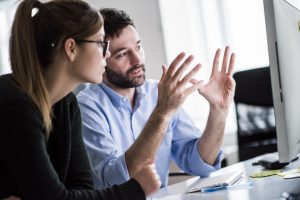 Man and woman working in office