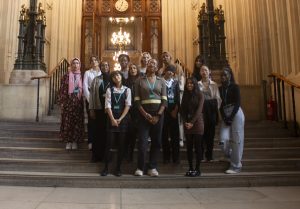 A group photo of last year's Summer School participants on the steps of the Houses of Parliament. 