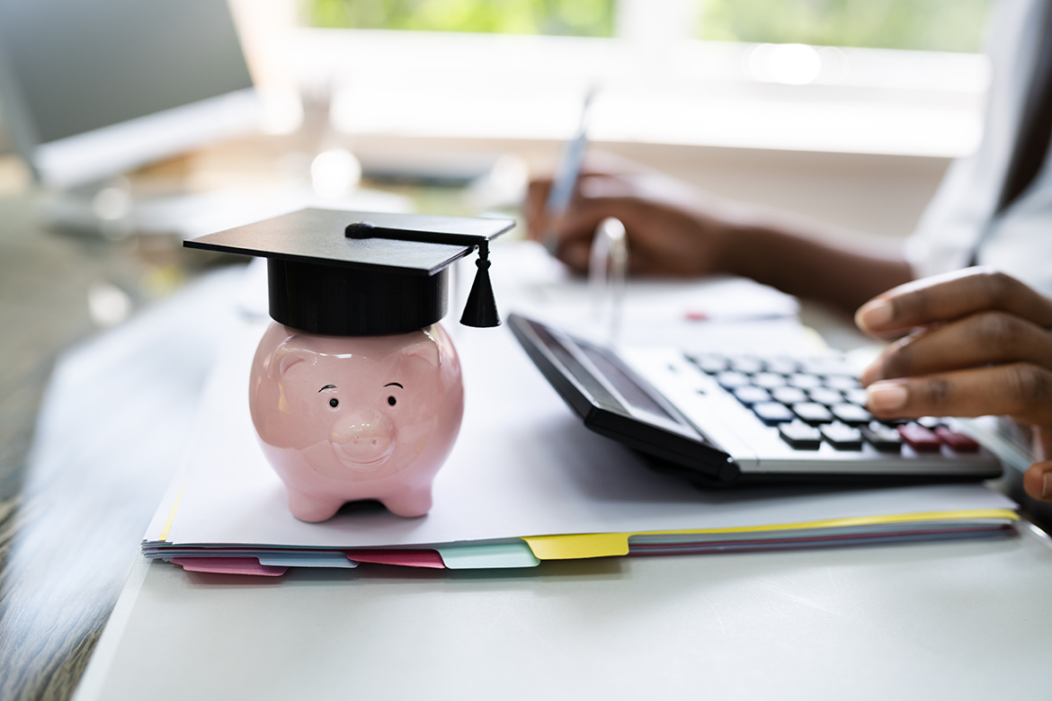 Piggy bank wearing mortarboard