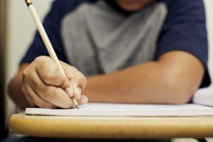 A child writing with a pencil