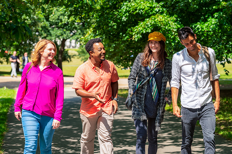 People walking in a sunny park