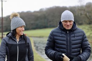 Two people walking in countryside