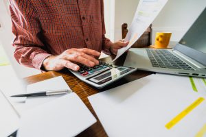 Man using calculator