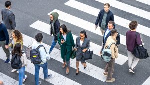 People walking across a zebra crossing