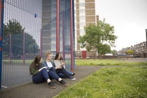 Teenagers sitting outside