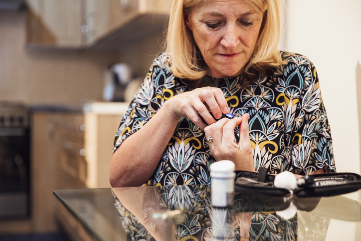 Woman checking her glucose