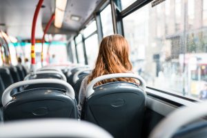 Young girl with red hair on bus