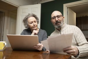 Middle-aged couple looking at their finances