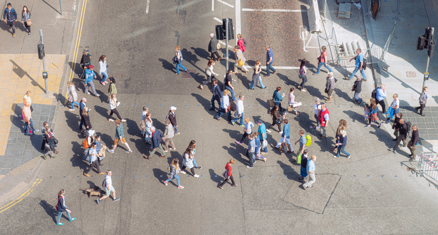 People walking across a street