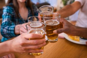 People drinking pints